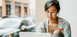 An image of an individual working on their laptop.